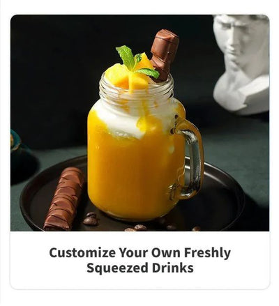 Mason jar with a layered drink, topped with mango pieces and a chocolate bar, on a dark surface kitchen
